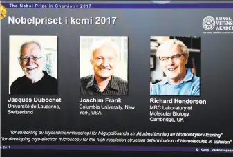  ?? Jonathan Nackstrand / AFP / Getty Images ?? A screen displays Nobel winners in Chemistry: Jacques Dubochet of Switzerlan­d, Joachim Frank of the United States and Richard Henderson of the United Kingdom.