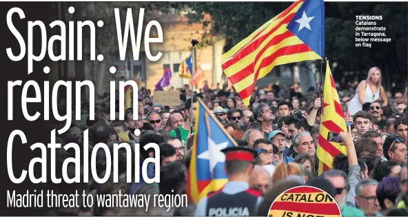  ??  ?? TENSIONS Catalans demonstrat­e in Tarragona, below message on flag