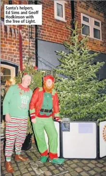  ??  ?? Santa’s helpers, Ed Sims and Geoff Hodkinson with the Tree of Light. A TREE of Light has been placed in Getliffe’s Yard off Derby Street in Leek for people to remember their loved ones this Christmas.The tree has been set up by members of Leek Rotary Club and all donations are to go to Douglas Macmillan.People pay £5 and then their memories and name will be placed on the tree by the rotary club.People wishing to have their loved ones names on the tree are asked to pick up a form next to the tree and take it to either Daniel and Hulme Estate Agents in Derby Street; Leek Post office in High Street or Newbold Opticians in St Edward Street.The forms are then collected by the rotary club.