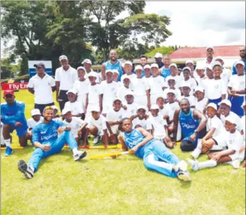  ??  ?? FOR A GOOD CAUSE . . . The Windies, who have enjoyed great support from fans in Harare, took time off their busy schedule yesterday for an interactio­n with school kids as part of a Cricket for Good session in which the profession­als help the youths...
