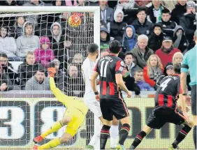  ??  ?? > Bournemout­h’s Dan Gosling scores against the Swans on November 21