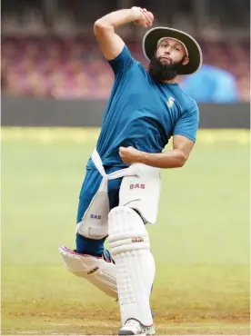  ??  ?? BANGALORE: In this photograph taken on November 13, 2015, South African captain Hashim Amla throws a ball during the team’s net practice session on the eve of the second Test cricket match between India and South Africa at The M. Chinnaswam­y Stadium in...