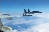  ?? PROVIDED TO CHINA DAILY ?? PLA Air Force aircraft conduct a patrol exercise on Monday near Taiwan. The military says such drills are strategica­lly important.