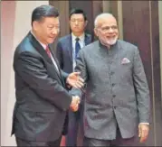  ?? PTI ?? Prime Minister Narendra Modi and China’s President Xi Jinping interact on the sidelines of the SCO summit in Qingdao, China.