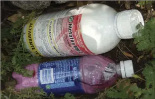  ??  ?? In this undated photo provided by the California Department of Fish and Wildlife, are bottles of chemicals left at a public land marijuana grow in California’s central valley. California pot growers choosing to go legal in the New Year will face a host...