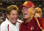  ?? GETTY IMAGES ?? Head coach Joe Gibbs (right with assistant head coach Joe Bugel in 2005), led the Washington Redskins to three Super Bowl titles. But the franchise has fallen on hard times and has not won a playoff game since 2005.