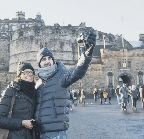  ??  ?? 0 Will the number of tourists travelling to Scotland to visit attraction­s such as Edinburgh Castle take a downturn?