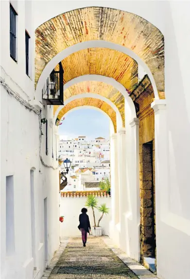  ??  ?? With its web of blinding-white streets, slender palms and a church on the site of an old mosque, Vejer fuses Andalucian and Moroccan influences