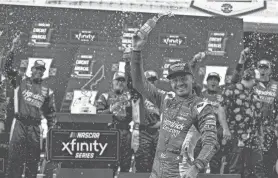  ?? AARON E. MARTINEZ/AMERICAN-STATESMAN/USA TODAY NETWORK ?? Kyle Larson celebrates winning the NASCAR Xfinity Series race in Texas on March 23. Larson also won last year’s Cup Series race at Richmond, the site of NASCAR racing this weekend.