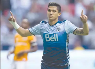  ?? The Canadian Press ?? Vancouver Whitecaps striker Fredy Montero celebrates after scoring on a penalty kick during first-half MLS action against the Houston Dynamo in Vancouver on Saturday night.