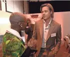  ?? KEVORK DJANSEZIAN/GETTY IMAGES ?? That’s Brad Pitt with a name tag with Cynthia Erivo at the Oscars nominees lunch.