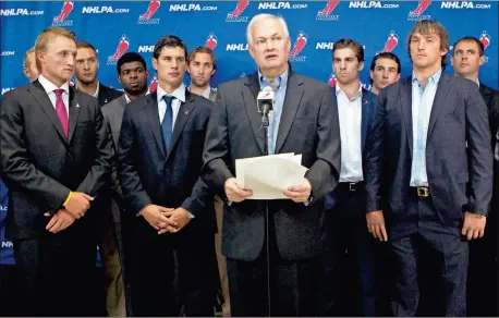  ?? AP-Chris Young, File ?? Donald Fehr, center, executive director of the National Hockey League Players’ Associatio­n, stands with NHL hockey players including Tampa Bay Lightning’s Steven Stamkos, left, Pittsburgh Penguins’ Sidney Crosby, second from left, and Washington Capitals’ Alex Ovechkin, right, as they speak with reporters following collective bargaining talks in Toronto. The NHLPA announces its decision whether to terminate the current collective bargaining agreement and set the clock ticking toward another potential work stoppage in 2020.