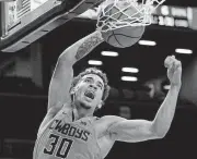  ?? [AP PHOTO] ?? Oklahoma State’s Jeffrey Carroll dunks during Tuesday’s game against Pittsburgh at the Legends Classic in Brooklyn, N.Y. Carroll helped the Cowboys beat the Panthers 73-67 for third place in the tournament.