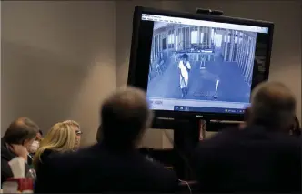  ?? Ap ?? prosecutor linda dunikoski shows a video of ahmaud arbery walking through a house under constructi­on during the trial of Greg mcmichael and his son, travis mcmichael, and a neighbor, William ‘roddie’ bryan in the Glynn county courthouse, tuesday in brunswick, Ga.