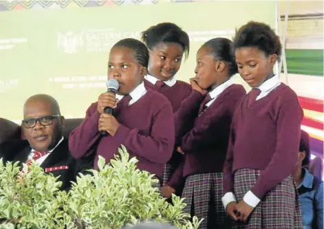  ?? Pictures: DESMOND COETZEE ?? YOUNG VOICES: BCM Mayor Xola Pakati listens to a poem by a group of pupils from a local primary school