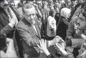  ?? AP ?? Turkey’s President Recep Tayyip Erdogan greets supporters as he leaves a polling station Sunday in Istanbul.