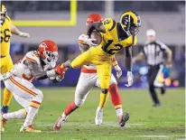  ?? MARCIO JOSE SANCHEZ/ASSOCIATED PRESS ?? Rams receiver Brandin Cooks (12) is tripped up by Kansas City’s Ron Parker during Monday’s game.