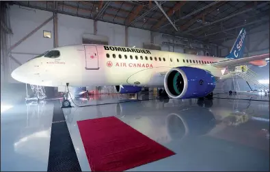  ?? The Canadian Press/PAUL CHIASSON ?? A Bombardier C Series jet sits in a Montreal hangar in 2016. The British government fears plans for new U.S. duties on the aircraft would risk Northern Ireland jobs.