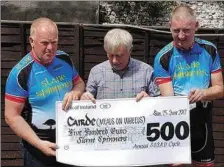  ??  ?? Slane Spinners recently made a presentati­on to the local Cairde, proceeds of a charity spin. Pictured at the presentati­on are Spinners members Kevin Carolan and Brian Kelly with Jimmy Mooney, treasurer of Cairde.