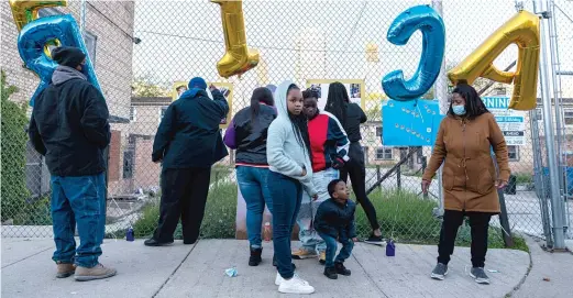  ?? TYLER LARIVIERE/SUN-TIMES ?? Family and community members gathered for a memorial and balloon release for Erica Gibson, 12, on Tuesday. Erica was shot and killed in Hazel Crest last weekend.