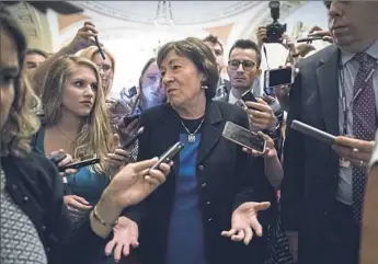  ?? J. Scott Applewhite/Associated Press ?? Sen. Susan Collins, R-Maine, is surrounded by reporters Thursday on Capitol Hill in Washington after a revised version of the Republican health care bill was announced by Senate Majority Leader Mitch McConnell of Kentucky. The bill has faced opposition...