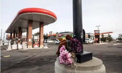  ?? Photograph: Canadian Press/Shuttersto­ck ?? Flowers and a teddy bear lie at the scene of the shooting deaths of a father and his 11-year-old son, in Edmonton, Canada, on Friday.