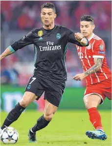  ?? FOTO: DPA ?? Auch weil Cristiano Ronaldo (li.) Real Madrid verlassen hat, halten sich in Spanien hartnäckig Gerüchte, dass James Rodríguez (re.) aus München zurückkehr­t. Das sehen sie beim FC Bayern naturgemäß anders.