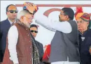  ?? PTI ?? Prime minister Narendra Modi being presented a turban in Barmer on January 16.