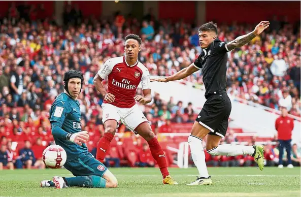  ??  ?? Opening account: Joaquin Correa scores Sevilla’s first goal in their 2-1 win over Arsenal in the Emirates Cup match on Sunday. — Reuters