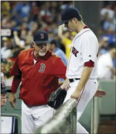  ?? THE ASSOCIATED PRESS ?? Boston Red Sox’s Drew Pomeranz leaves the field after being taken out during the fourth inning of a game against the Yankees on Sunday, Sept. 18. Pomeranz was one of several players the Padres didn’t disclose medical history on before trading him at...