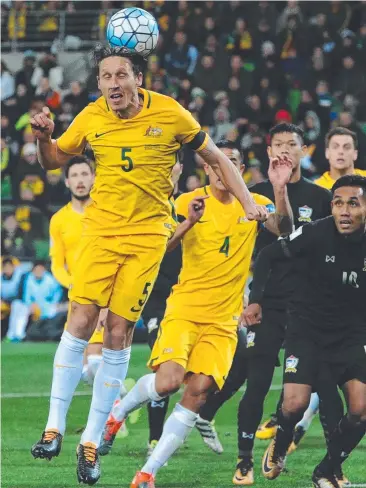  ?? Picture: AFP ?? CONFIDENT: Mark Milligan heads the ball during the World Cup qualifier against Thailand.