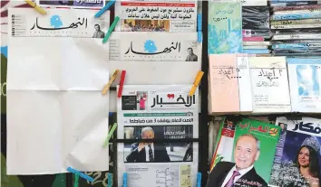  ?? Reuters ?? Blank editions of An Nahar stand out among other newspapers at a kiosk in Beirut yesterday.