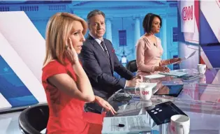  ?? IMAGES GETTY ?? CNN anchor Jake Tapper, center, expands his daily show to two hours, while Dana Bash, left, will alternate as host of CNN’S Sunday public-affairs show.