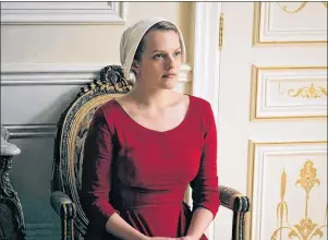  ?? AP PHOTO ?? This image released by Hulu shows Elisabeth Moss as Offred in a scene from, “The Handmaid’s Tale.” The wrenching loss of an infant to a totalitari­an society will be explored in season two of “The Handmaid’s Tale” which returns April 25 on streaming...