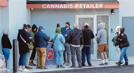  ?? H John Voorhees III/Hearst Connecticu­t Media ?? A line of customers wait to enter Fine Fettle, Norwalk's first cannabis dispensary, which opened for business on Thursday morning. The dispensary is located at 191 Main St. in Norwalk.