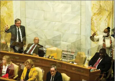  ?? (Arkansas Democrat-Gazette/Stephen Swofford) ?? State Reps. Milton Nicks Jr. and Vivian Flowers raise their hands Monday to speak in favor of a motion to uphold a ruling by the committee chairman on Senate Bill 622, the state’s modified hate crimes legislatio­n. Many members of the House felt the House Judiciary Committee chairman ended a meeting on the legislatio­n prematurel­y last week and didn’t allow for a roll-call vote. The bill was heard and passed by the General Assembly.