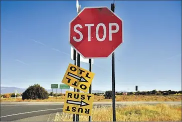  ?? Sam Wasson Getty Images ?? A SIGN directs the way to the “Rust” set outside Santa Fe. It was only the second film on which Hannah Gutierrez Reed was the armorer, a profession in which she has been following in her father’s footsteps.