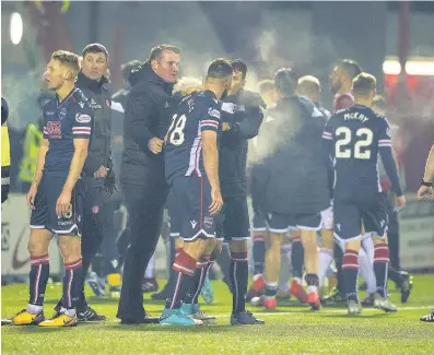  ??  ?? Ugly scenes A touchline bust-up marred the game and resulted in a red card for Hamilton’s Ioannis Skondras