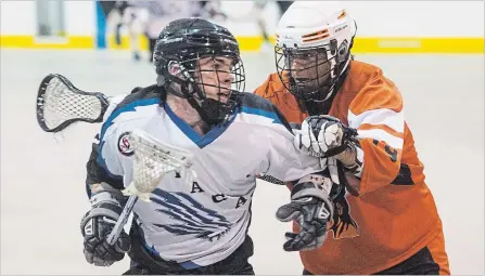  ?? JULIE JOCSAK THE ST. CATHARINES STANDARD ?? Niagara’s Trent Hunter, left, is defended by Six Nations’ Bo Peltier. The Niagara Thunderhaw­ks entered the junior B lacrosse playoffs as the seventh seed in the Western Conference after going 10-10 in league play.