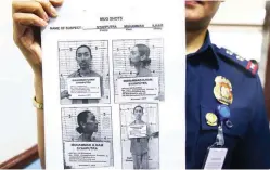  ??  ?? MARAWI SIEGE SUSPECT – Mugshots of Indonesian Muhammad lham Syahputra, who was arrested during government-clearing operations in Marawi City last Wednesday, are handed out at the Quezon City Police headquarte­rs. Syahputra is believed to have been...