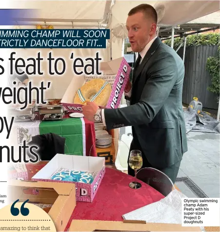  ??  ?? Olympic swimming champ Adam Peaty with his super-sized Project D doughnuts