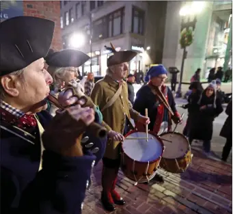  ?? STAFF PHOTO BY STUART CAHILL — BOSTON HERALD told the Herald. ?? Drum and fife players outside the Old South Meeting House as Boston celebrated the 250th anniversar­y of the Boston Tea Party Saturday.
just this one event,” Lane