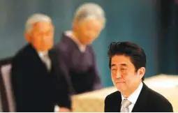  ??  ?? Japan’s Prime Minister Shinzo Abe (R) walks past Japan’s Emperor Akihito (L) and Empress Michiko during a memorial service ceremony marking the 70th anniversar­y of Japan’s surrender in World War Two at Budokan Hall in Tokyo, Japan August 15, 2015....