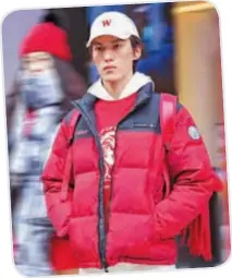  ?? ?? The latest Bosideng down jacket designs blend the zodiac sign and the lucky red hue for the upcoming Chinese Year of Dragon.