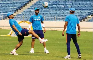  ?? – PTI ?? PLAYING FOOTBALL: Indian captain Virat Kohli and Mahendra Singh Dhoni with others at practice session in Pune on Tuesday.