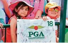  ?? AFP ?? Young fans watch their favourite stars in action as they wait for autographs during a practice round in Springfiel­d.