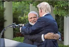  ?? JABIN BOTSFORD/ WASHINGTON POST ?? President Donald Trump and Indian Prime Minister Narendra Modi’s Rose Garden hug surprised onlookers.