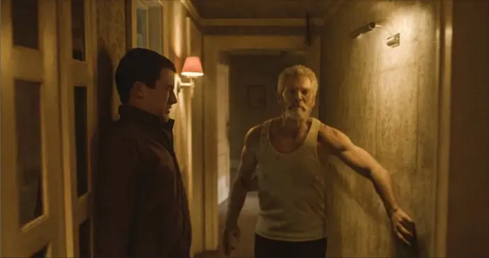  ?? , THE ASSOCIATED PRESS ?? Dylan Minnette, left, and Stephen Lang in a scene from Dont Breathe.