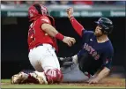  ?? RON SCHWANE — THE ASSOCIATED PRESS ?? Christian Arroyo of The Red Sox is tagged out by Guardians catcher Austin Hedges at home during the fifth inning Friday. Boston won 6-3.