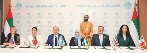  ?? WAM ?? Shaikh Mohammad during the launch of the Global Happiness Coalition in Dubai. An agreement establishi­ng the coalition was signed by Uhoud Khalfan Al Roumi, Minister of State for Happiness and Quality of Life, Portugal’s Maria Manuel Leitao Marques,...